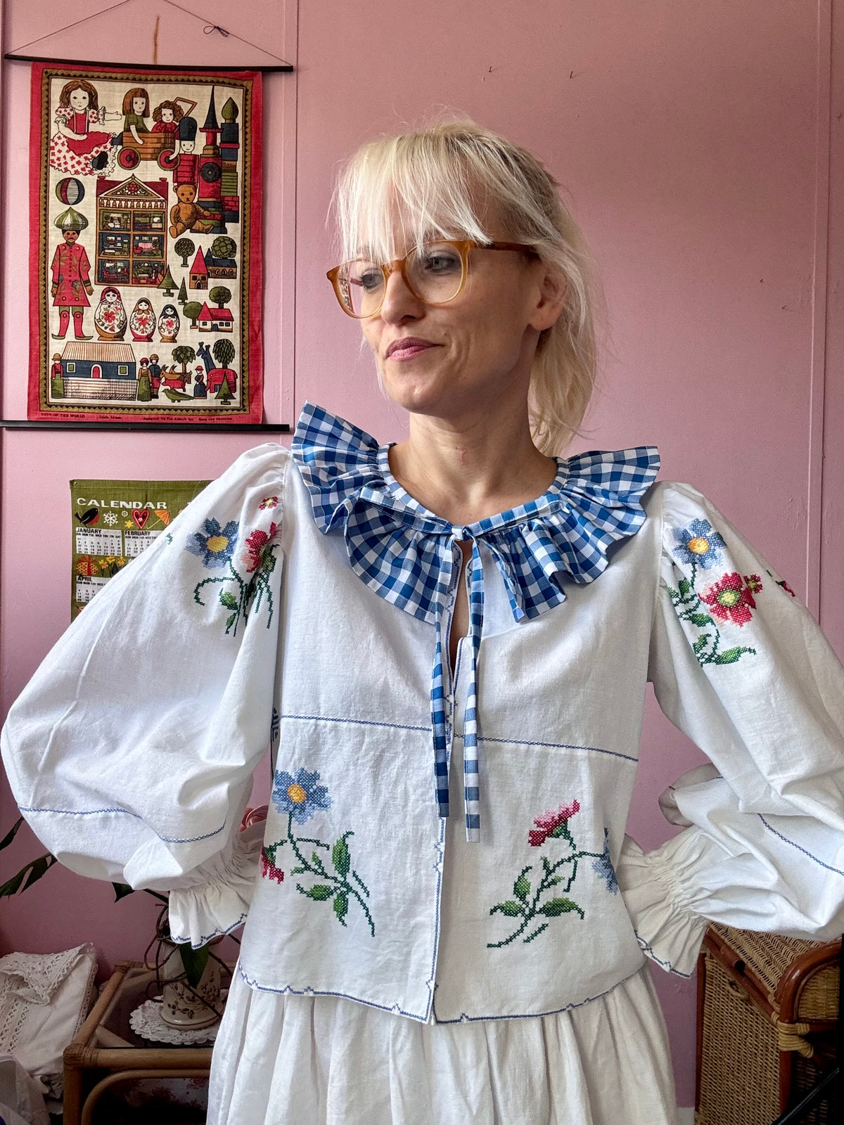 White blouse with blue ric rac neckline frill