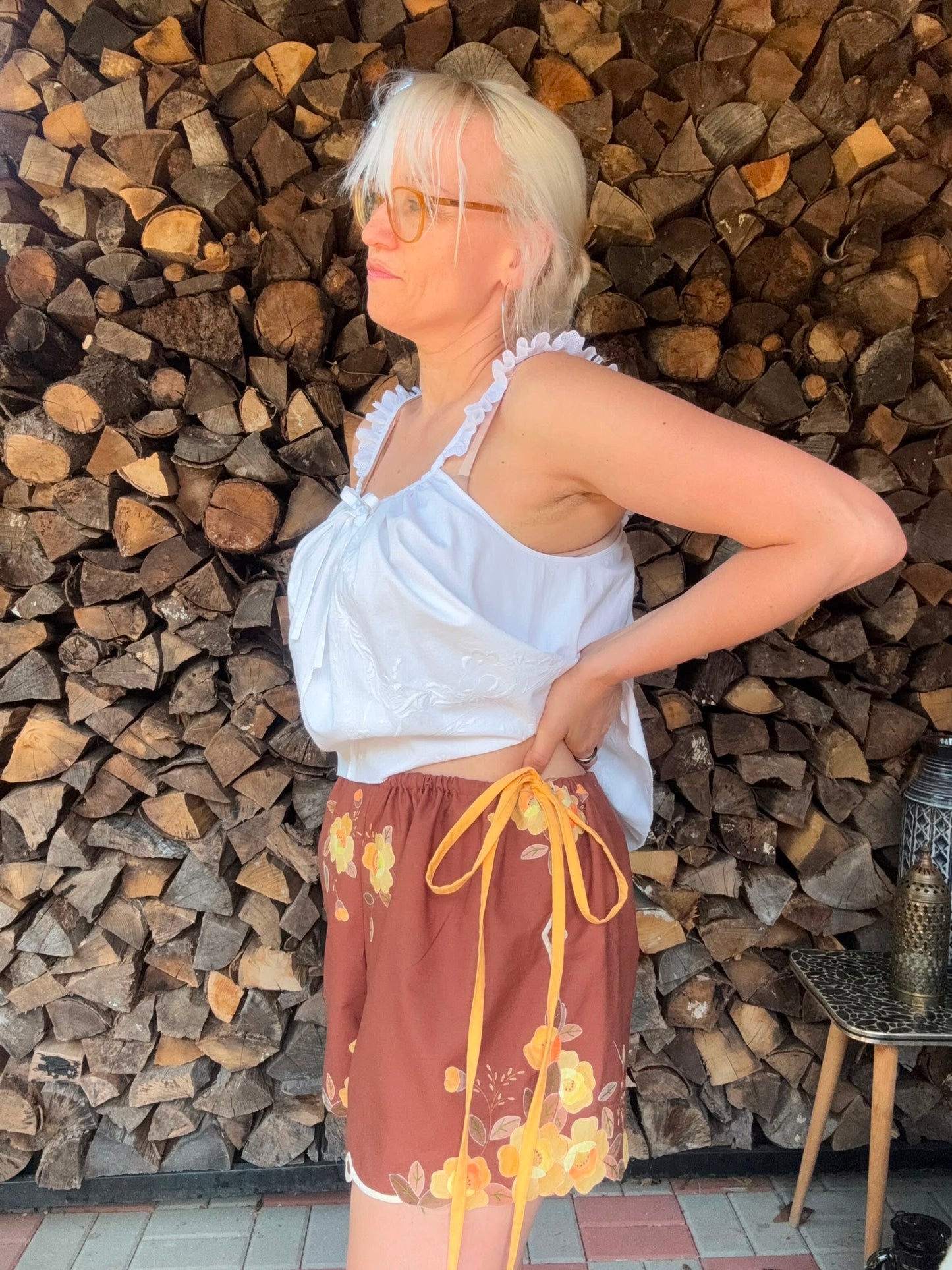 Brown shorts with yellow side straps