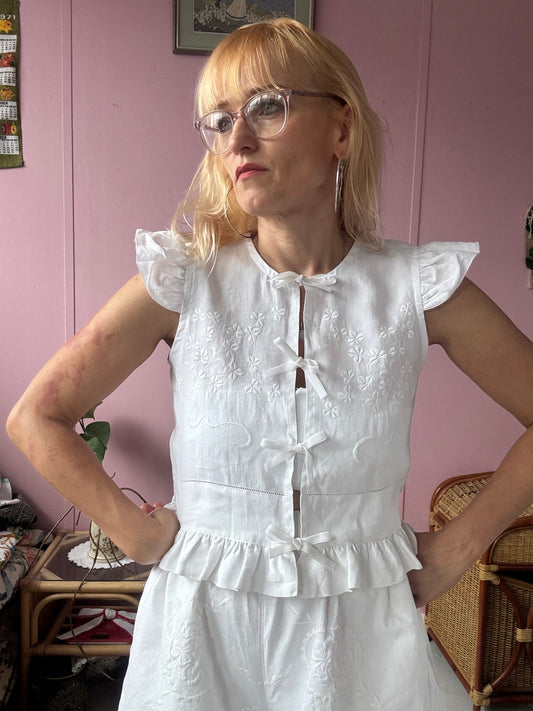 White floral blouse with velvet bows