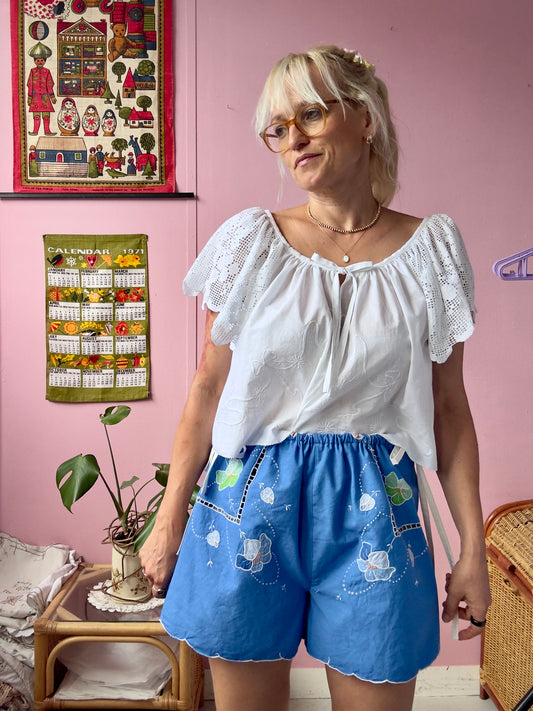 Blue shorts with white bows