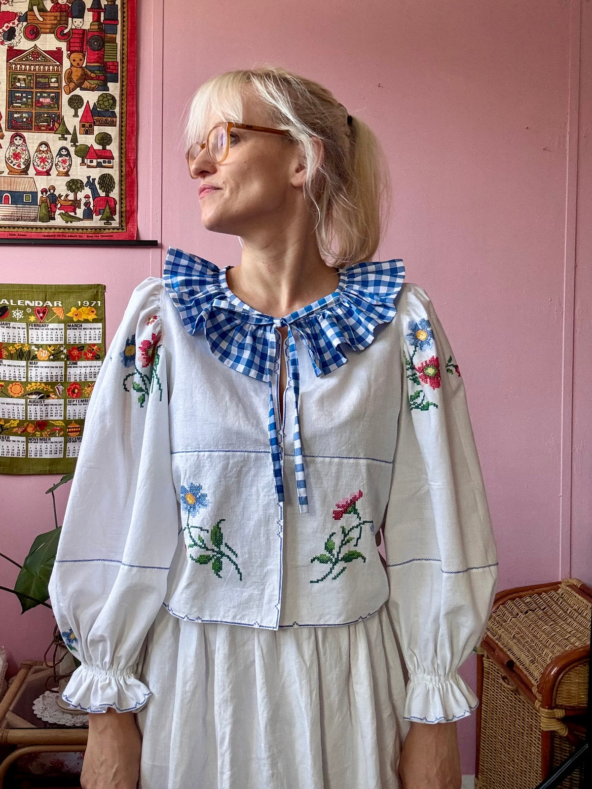 White blouse with blue ric rac neckline frill