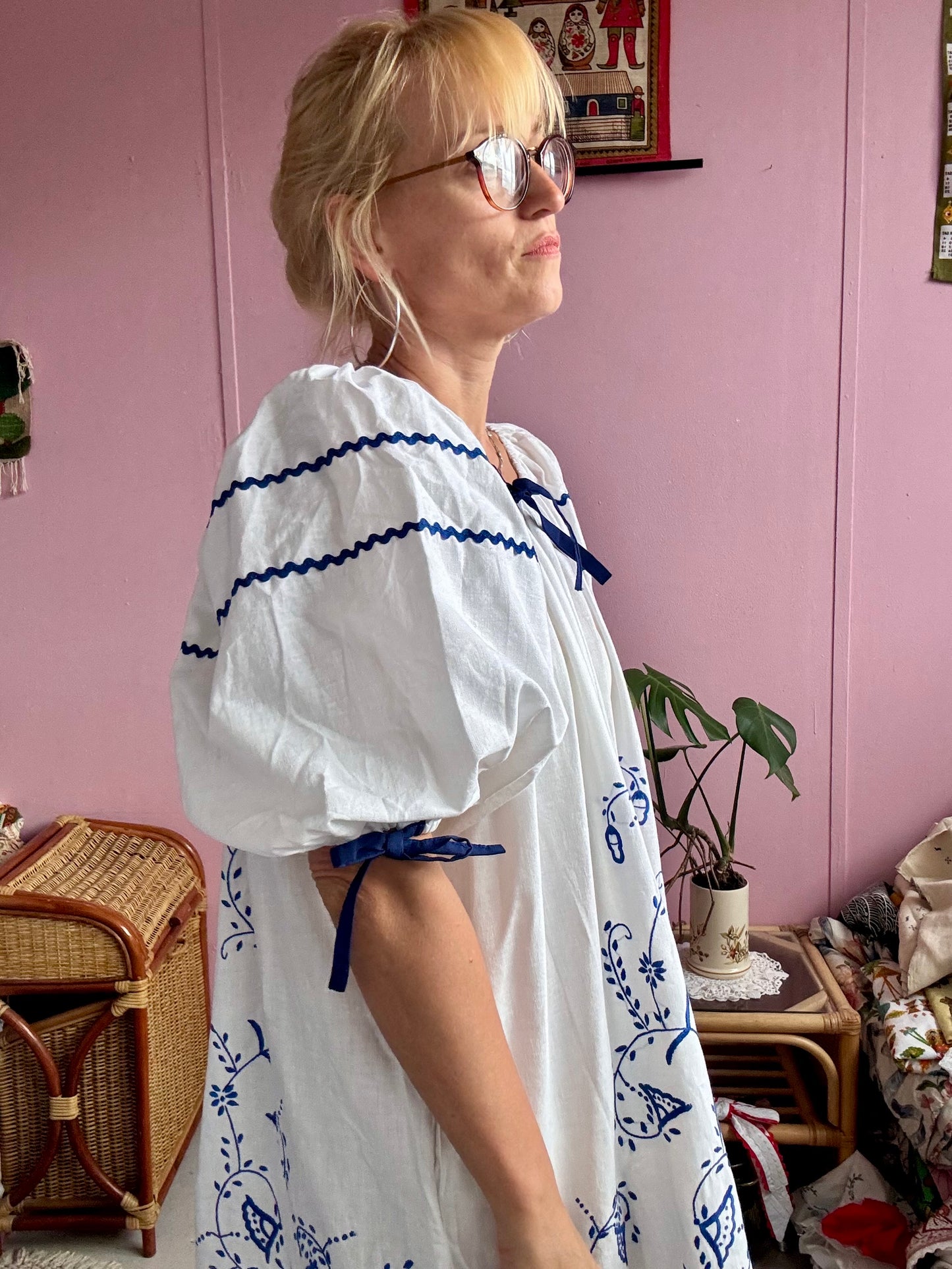 White mini dress with blue embroidery and blue bows
