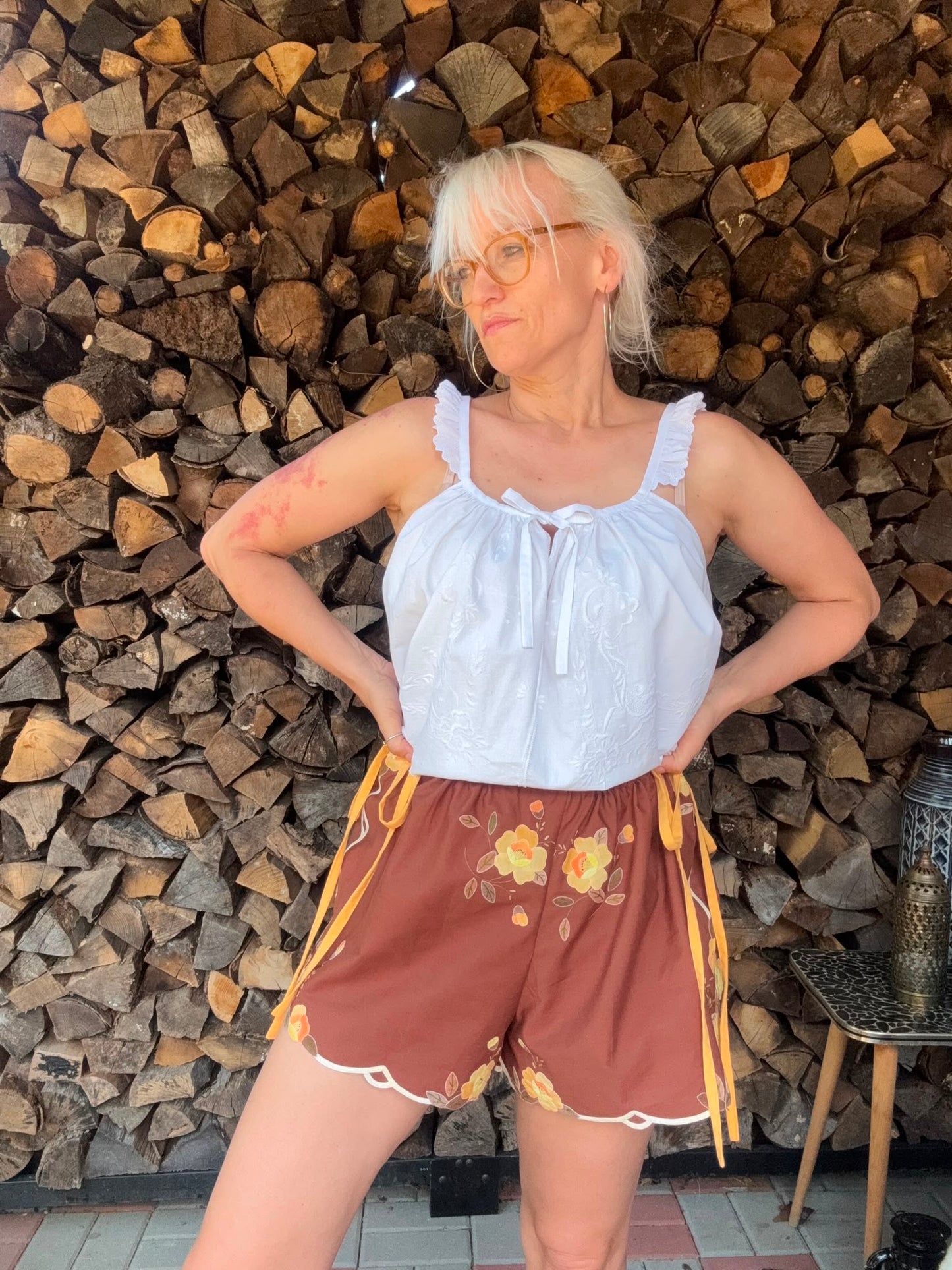 Brown shorts with yellow side straps