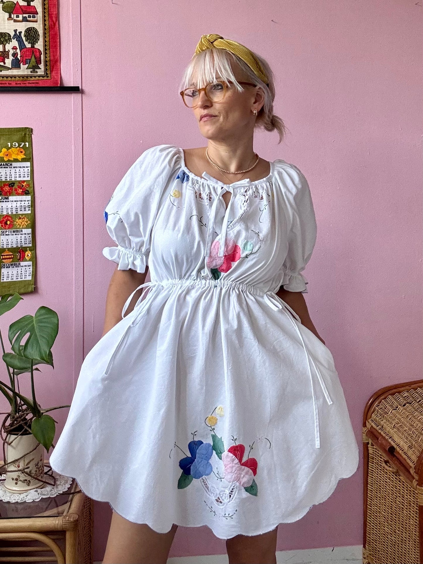 White mini dress with floral appliqués