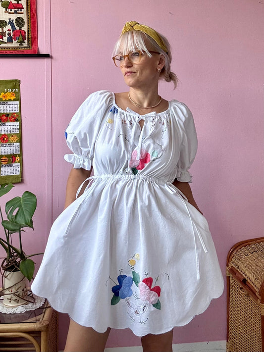 White mini dress with floral appliqués