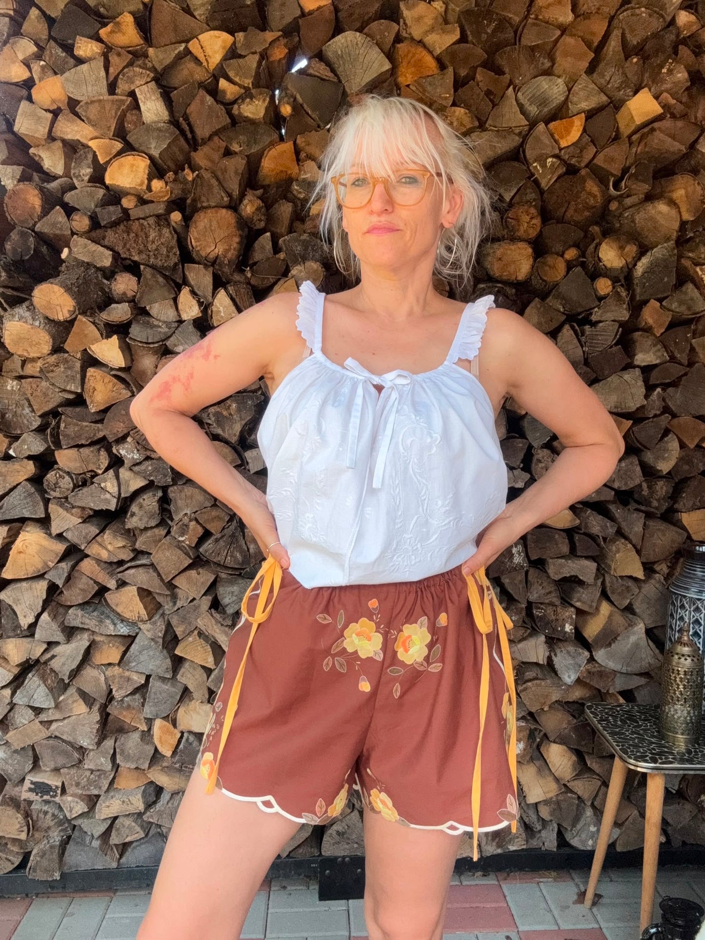 Brown shorts with yellow side straps