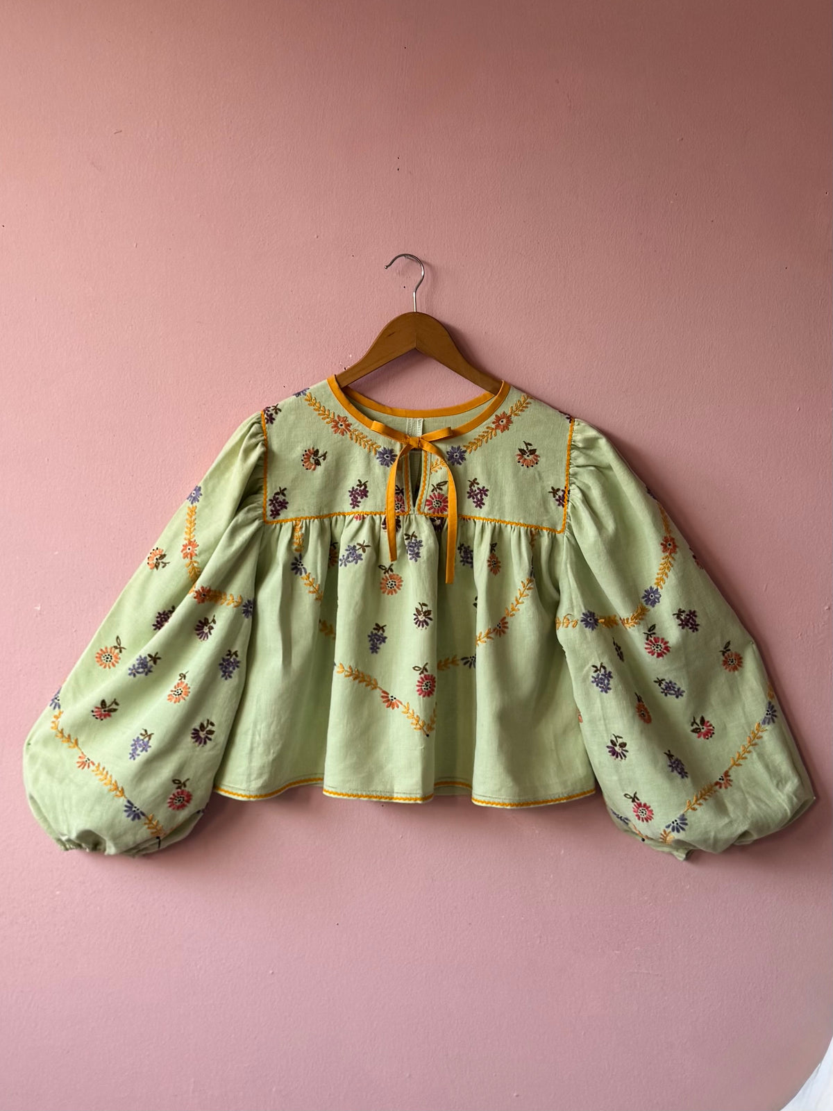 Green blouse with mustard yellow details