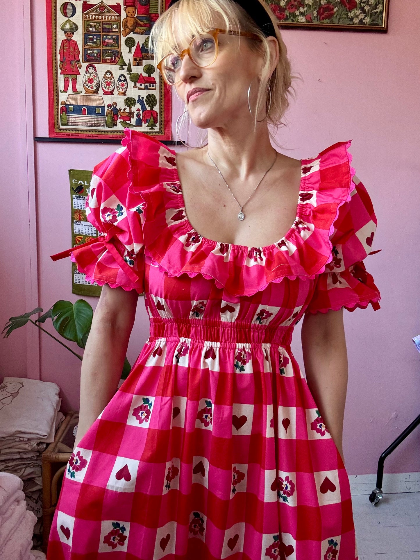 Pink/red dress with frills and ric rac