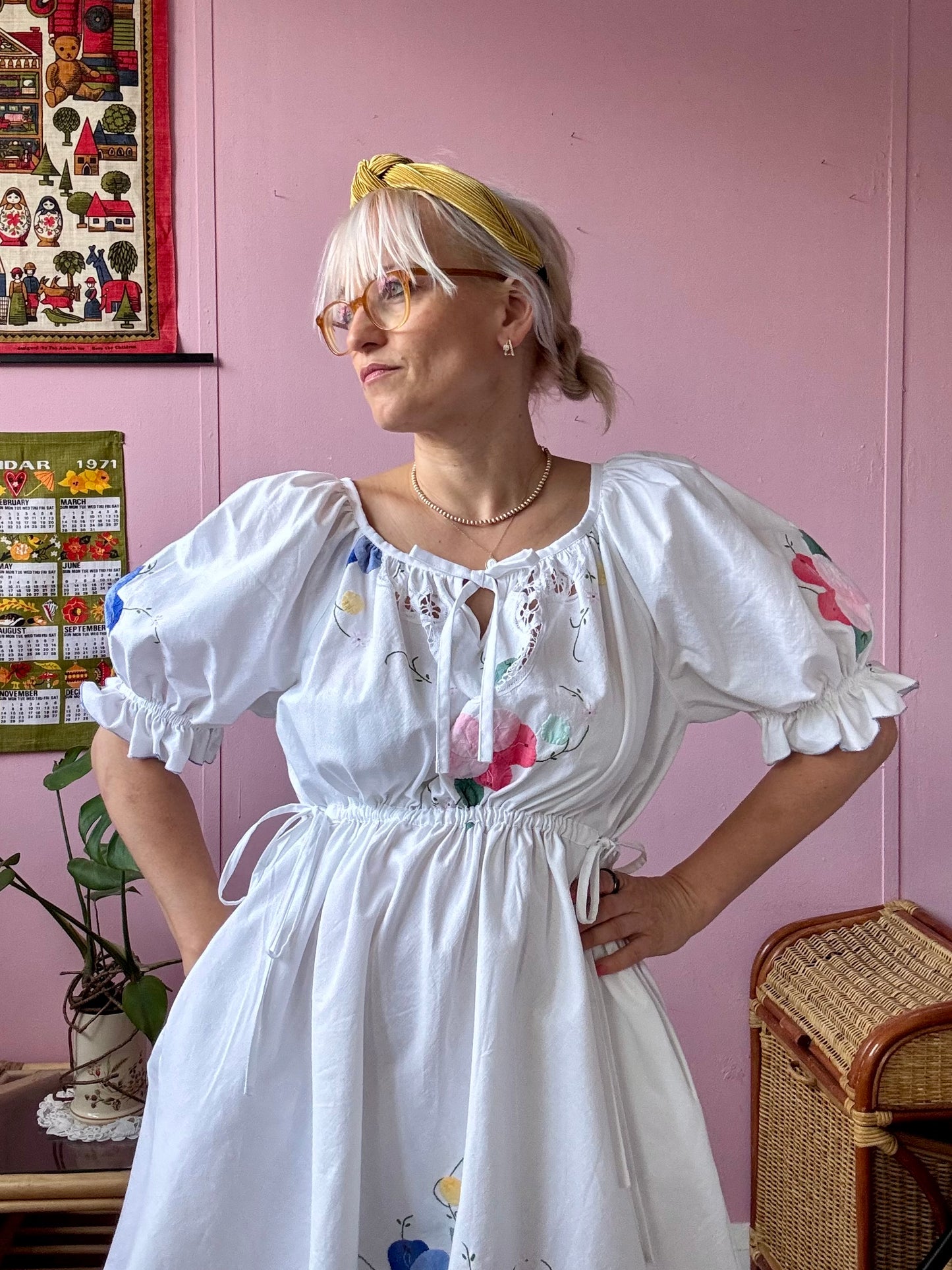 White mini dress with floral appliqués