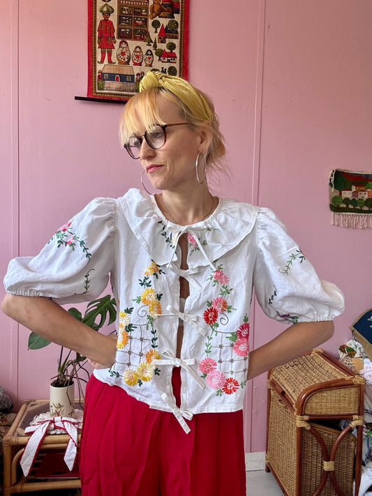 White floral blouse with neckline frill