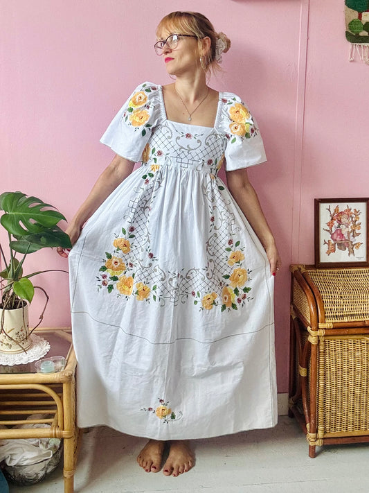 White maxi with yellow floral appliqués embroidery