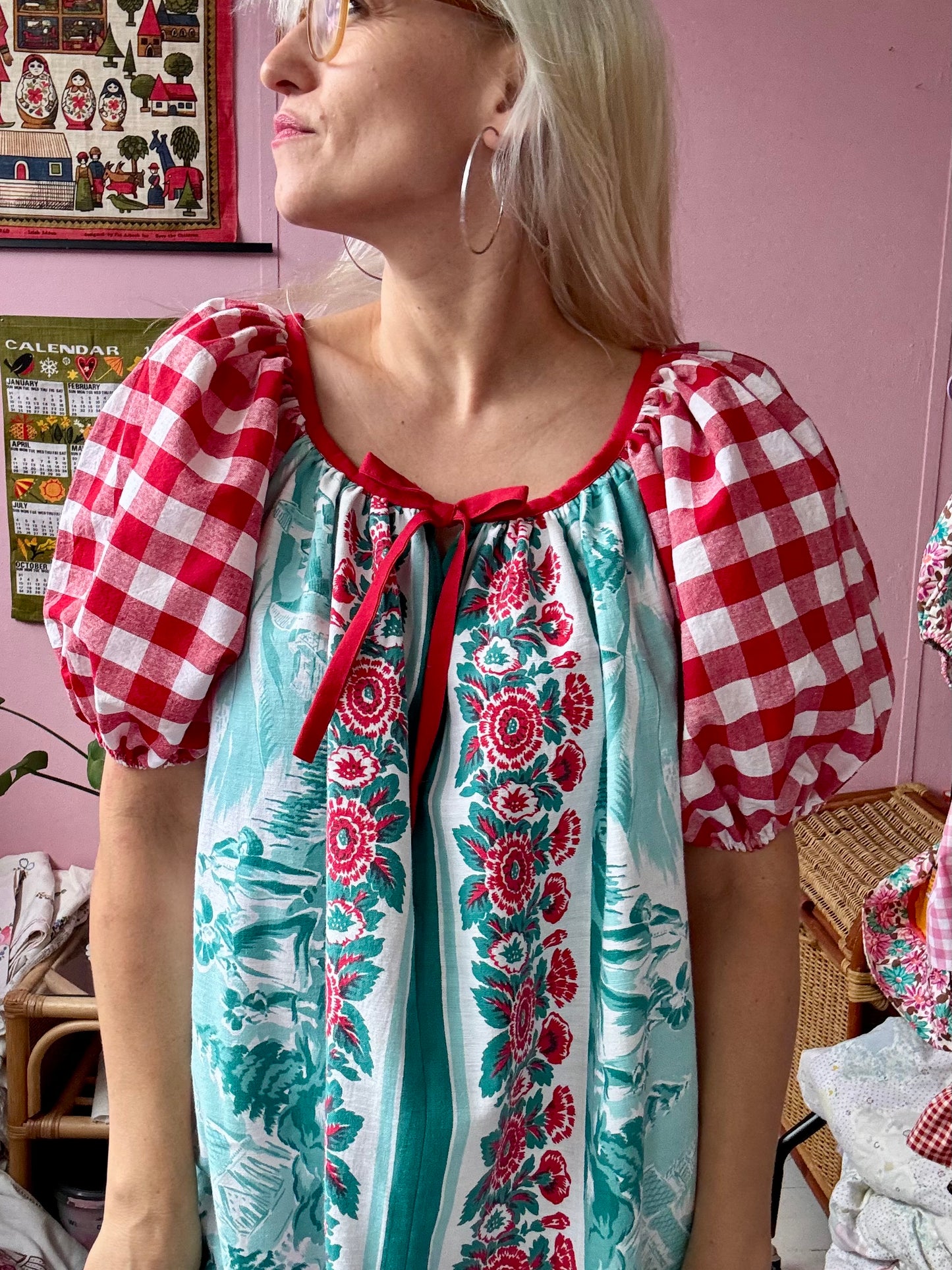 Vintage Tyrol village and red gingham dress
