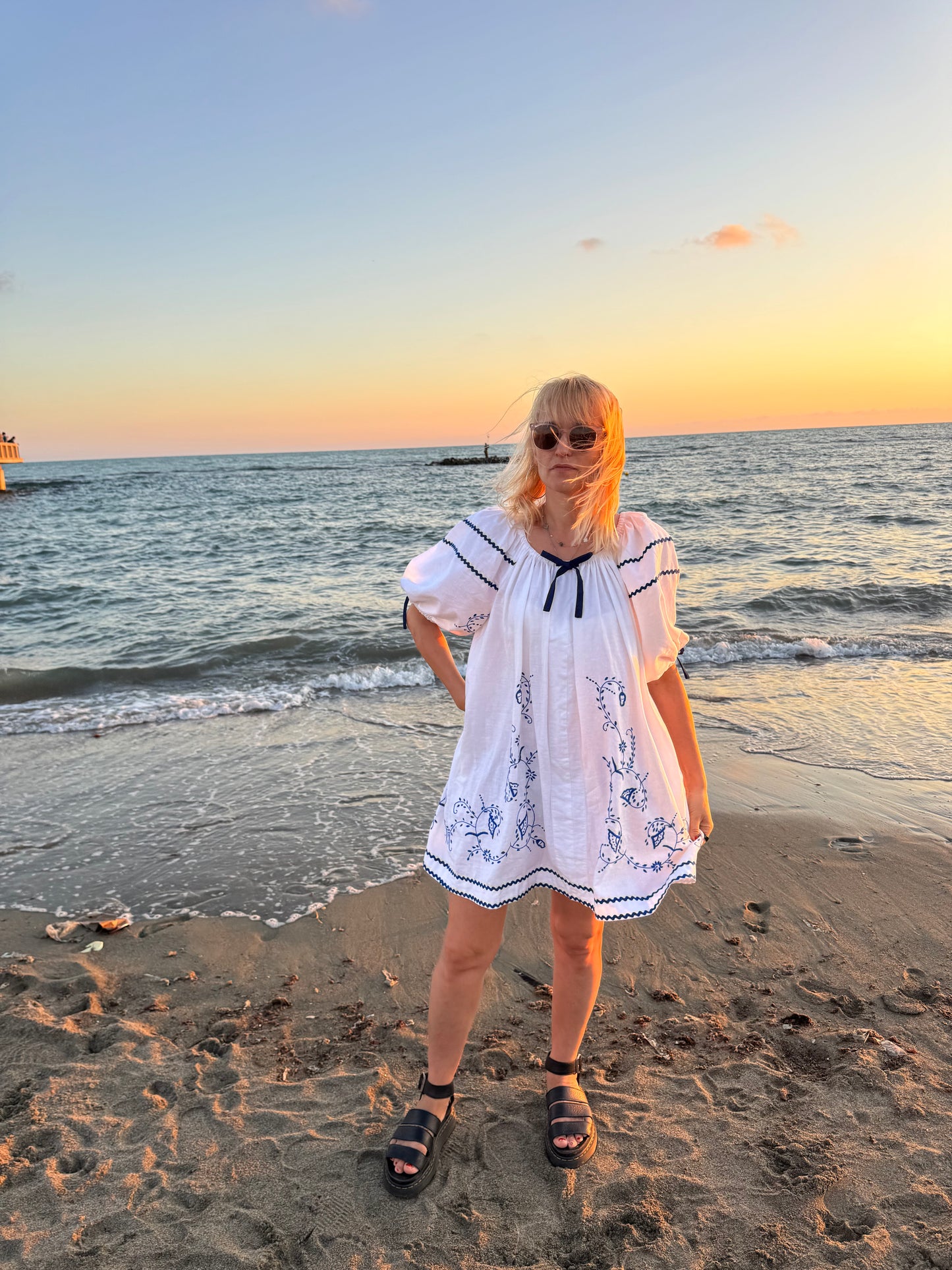 White mini dress with blue embroidery and blue bows