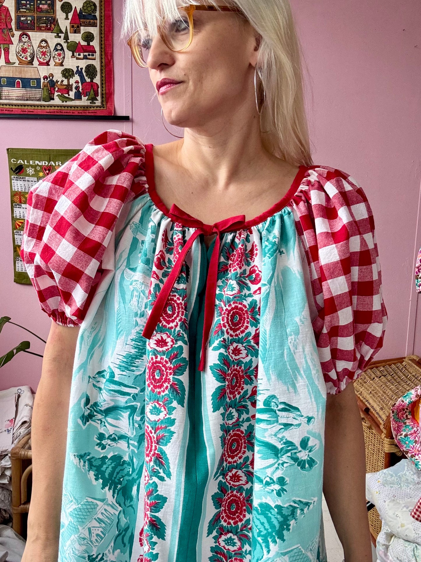 Vintage Tyrol village and red gingham dress
