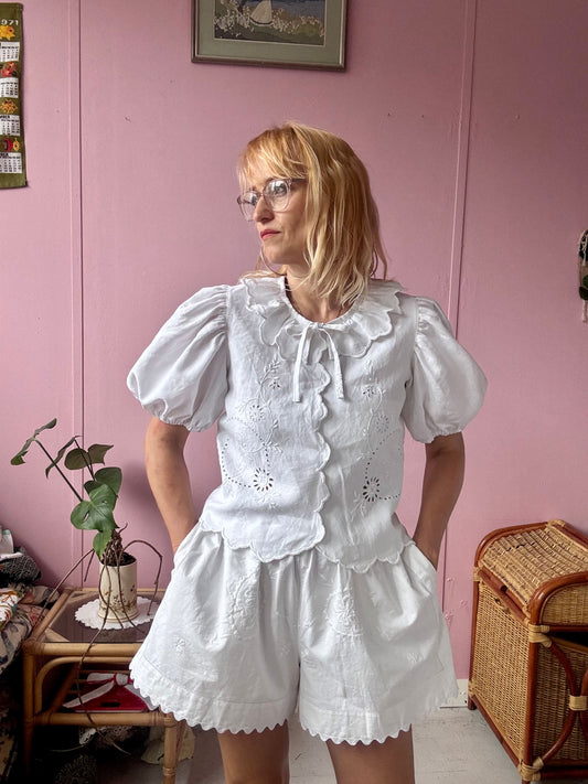 White blouse with neckline frill